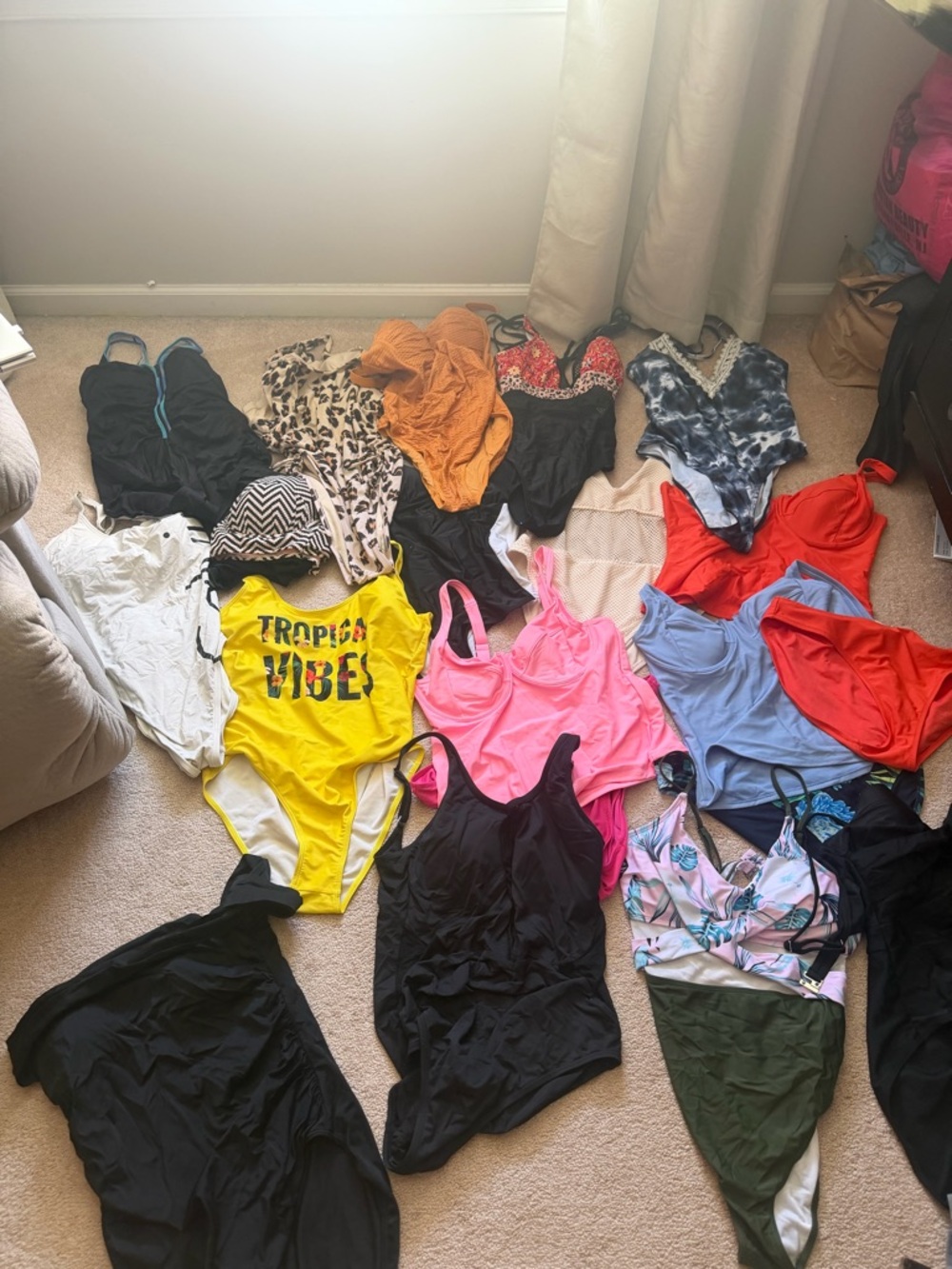 15 one piece and 3 tankinis